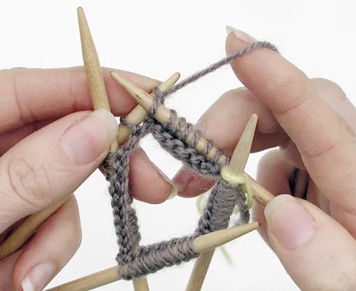 knitted in the round using three DPNs.